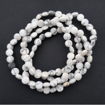 Bratara discuri ovale fatetate howlit alb 6x4 mm